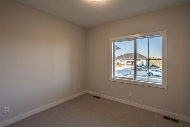 unfurnished room with carpet flooring