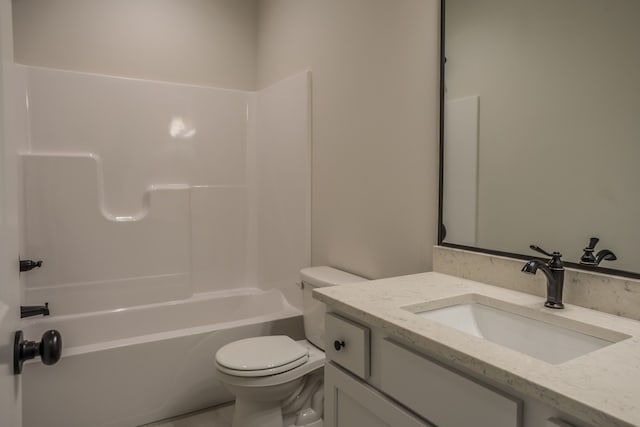 full bathroom with  shower combination, vanity, and toilet