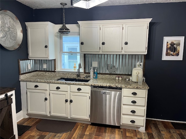 kitchen featuring stainless steel dishwasher, dark wood-type flooring, and white cabinets