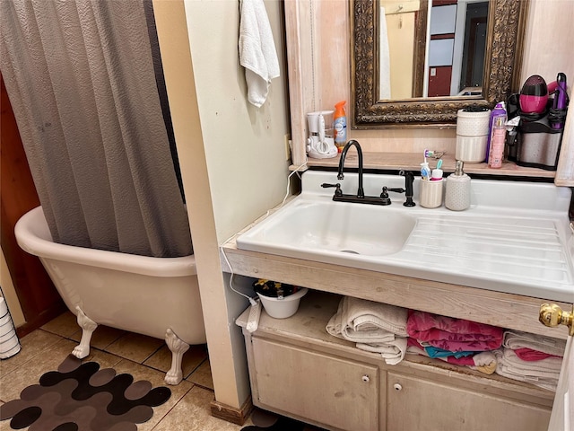 bathroom featuring tile patterned flooring and sink