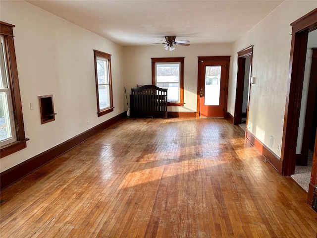 spare room featuring light hardwood / wood-style flooring and ceiling fan