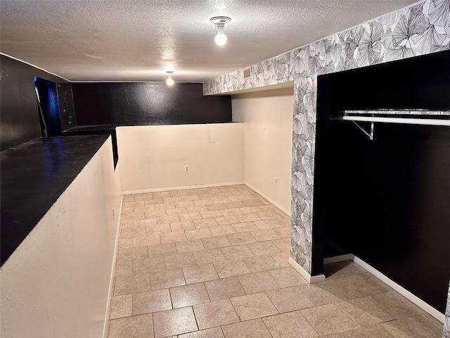 basement with a textured ceiling