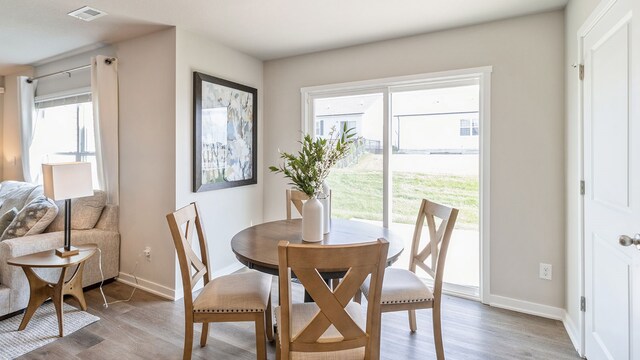 dining area featuring hardwood / wood-style floors and a wealth of natural light