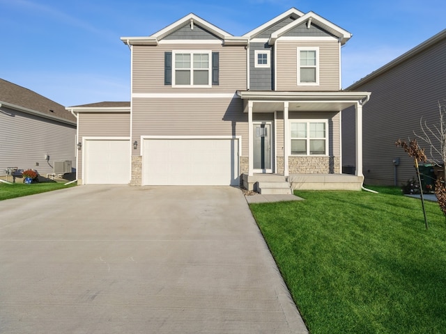 view of front facade with a front yard, a garage, covered porch, and central AC unit