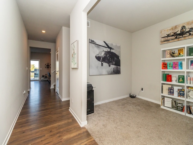 hall with dark hardwood / wood-style flooring