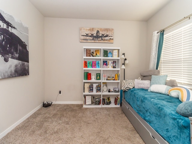 bedroom featuring light carpet