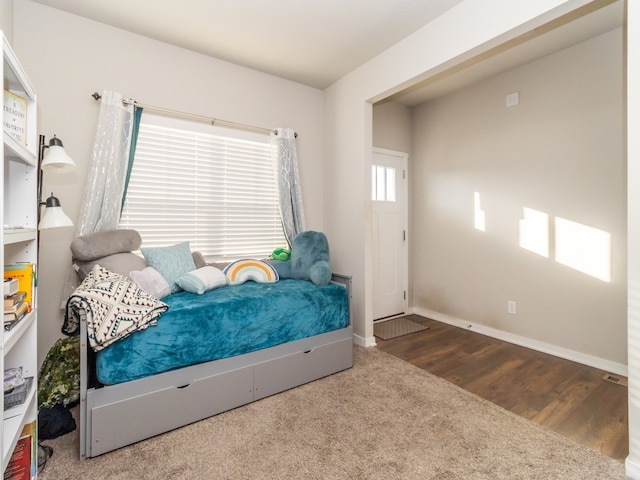 bedroom with hardwood / wood-style floors