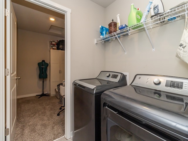 clothes washing area featuring carpet floors and independent washer and dryer