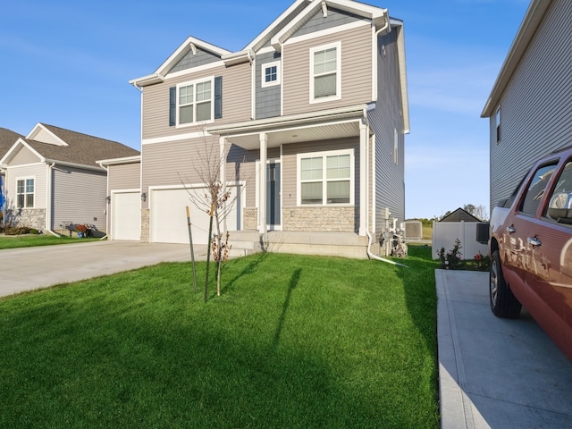 view of front of property featuring central AC unit, a front yard, and a garage