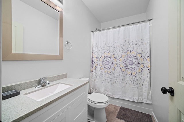 bathroom with vanity, tile patterned flooring, toilet, and curtained shower