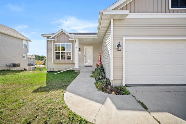 entrance to property featuring a lawn