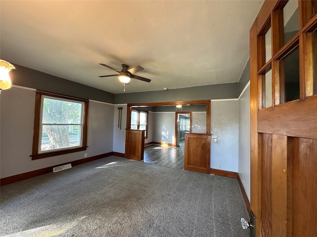 carpeted empty room with ceiling fan