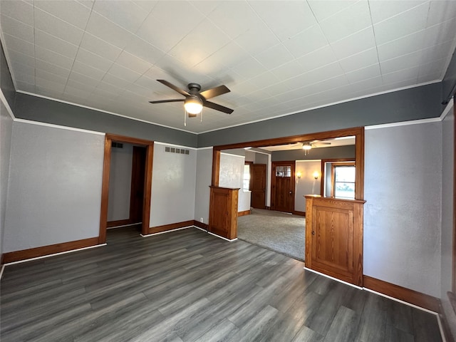 empty room with ceiling fan and dark wood-type flooring