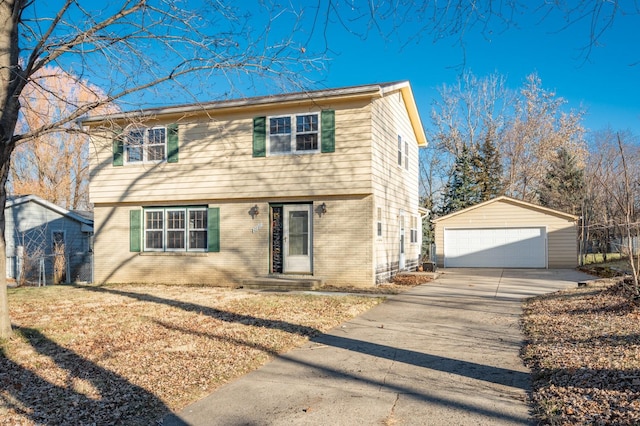 view of front of property with a garage and an outbuilding