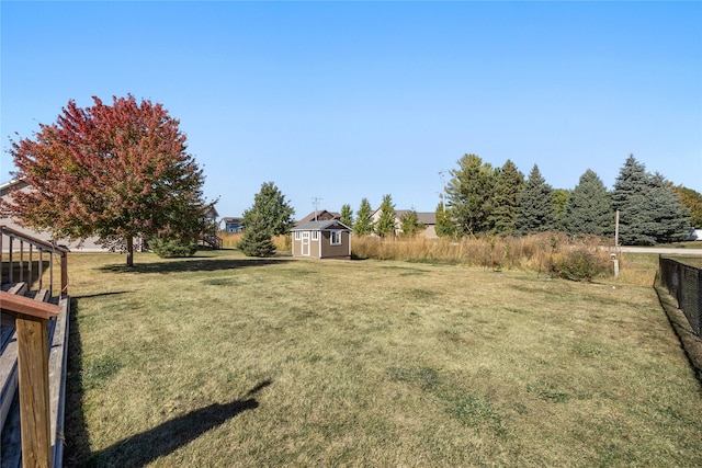 view of yard with a storage shed