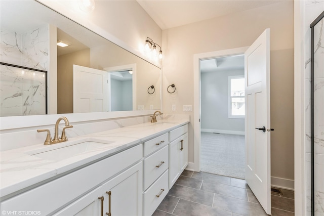 bathroom with vanity and a shower