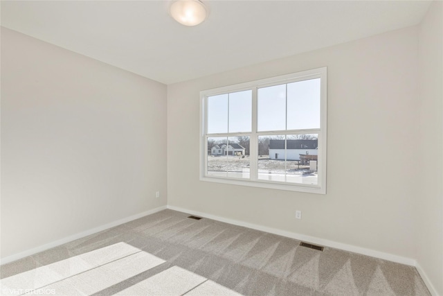 empty room with carpet flooring