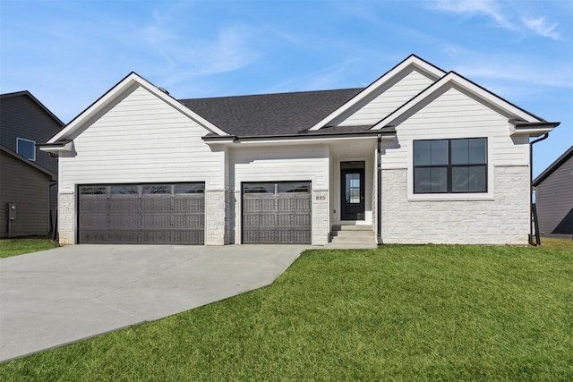 view of front facade featuring a front yard and a garage