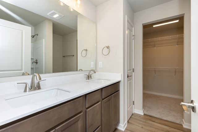 bathroom featuring hardwood / wood-style floors and vanity