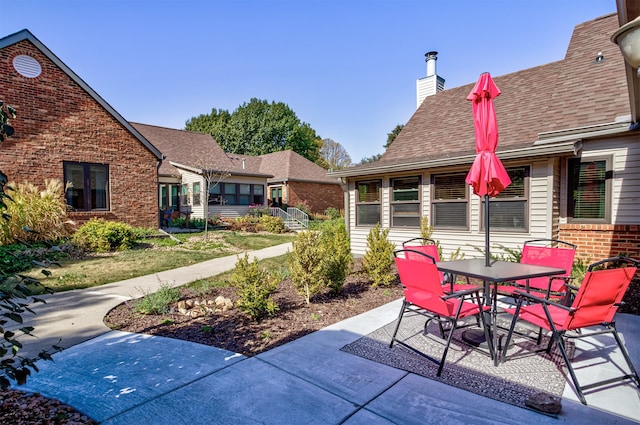 view of patio featuring outdoor dining space