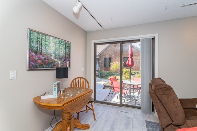 dining space with light hardwood / wood-style flooring