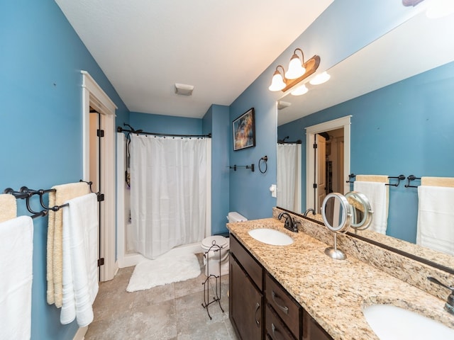 bathroom featuring vanity and curtained shower