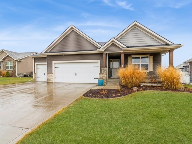 view of front of house featuring a front yard and a garage