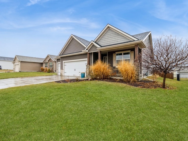 view of front of house with a front yard and a garage