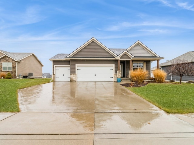 view of front facade featuring a front lawn and a garage