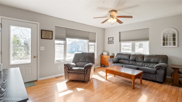 living room featuring ceiling fan and light wood-type flooring