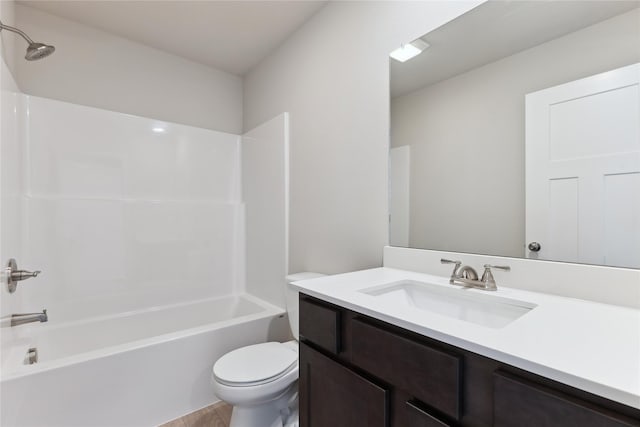 full bathroom featuring toilet, vanity, and  shower combination