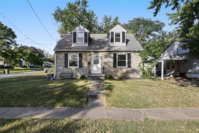 cape cod-style house with a front lawn