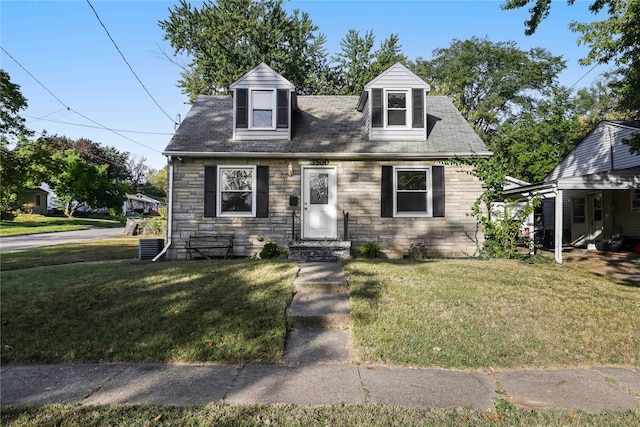 new england style home with a front yard