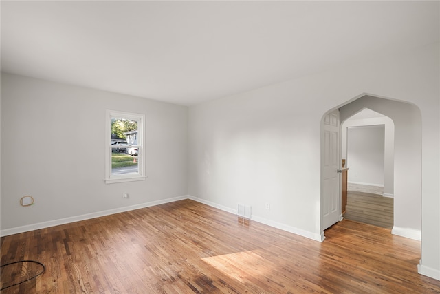 unfurnished room featuring wood-type flooring