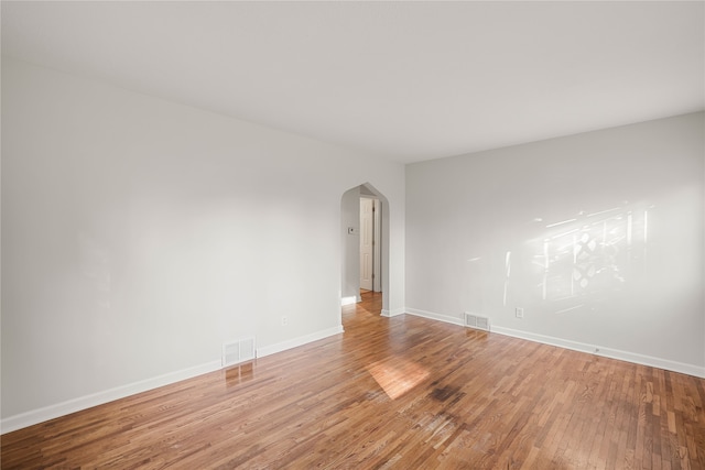 spare room featuring hardwood / wood-style flooring