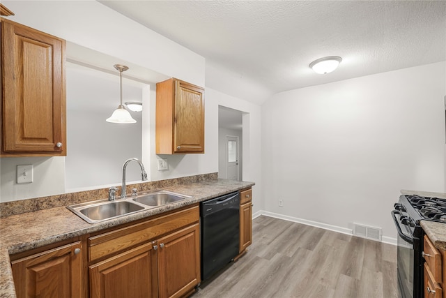 kitchen with decorative light fixtures, a textured ceiling, black appliances, light hardwood / wood-style flooring, and sink