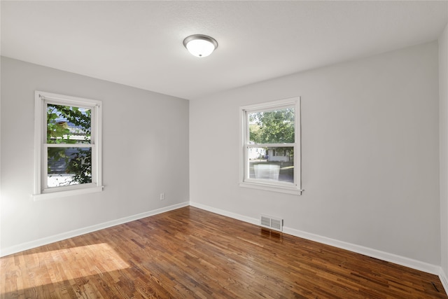 empty room featuring hardwood / wood-style floors