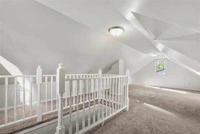 bonus room with carpet flooring and lofted ceiling