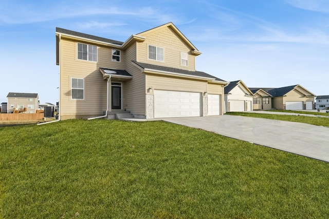 view of front facade featuring a garage, a front yard, and central AC unit