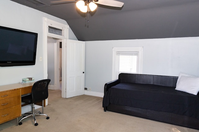 carpeted home office with ceiling fan and lofted ceiling