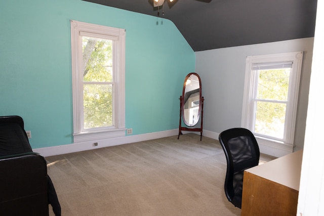 carpeted office featuring ceiling fan, a healthy amount of sunlight, and lofted ceiling