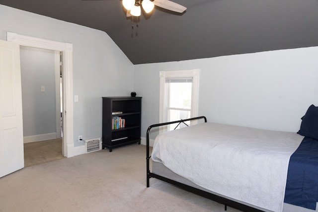 bedroom with carpet flooring, ceiling fan, and lofted ceiling