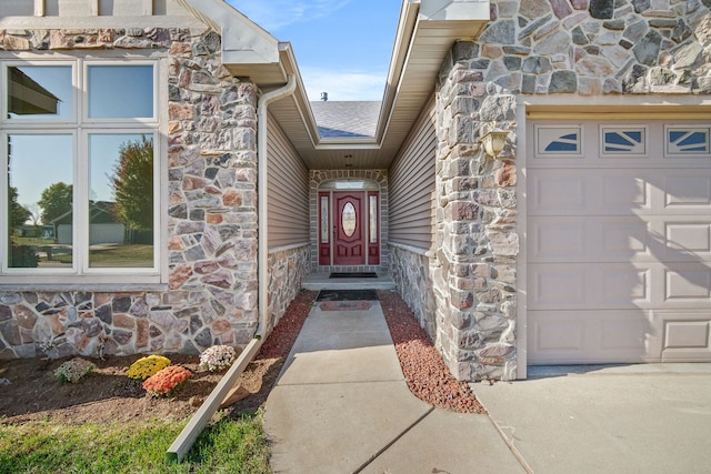 doorway to property featuring a garage