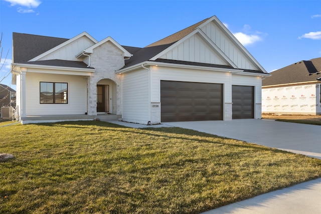 craftsman-style home with a front yard and a garage