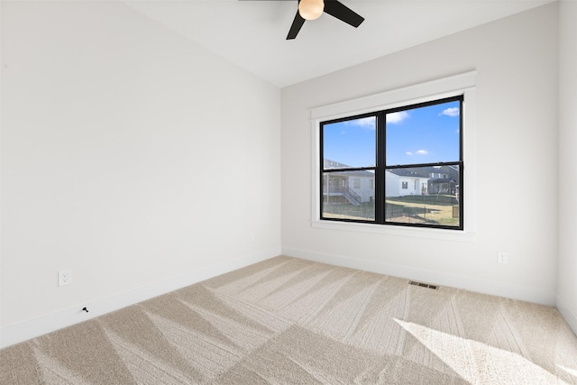 unfurnished room with carpet flooring and ceiling fan