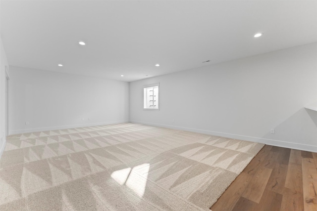 unfurnished room with light wood-type flooring