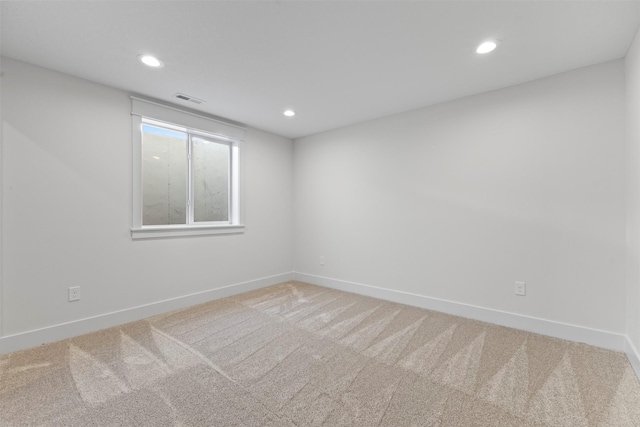 unfurnished room featuring carpet flooring