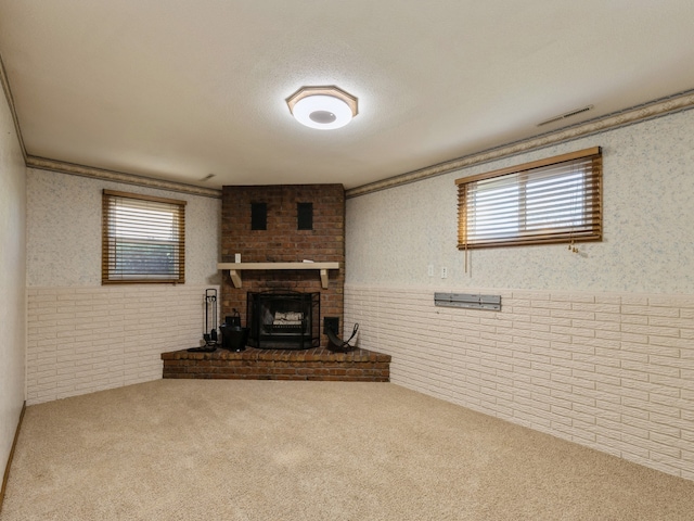 carpeted living room with a fireplace and plenty of natural light