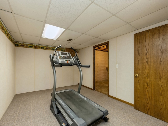 workout area featuring a paneled ceiling