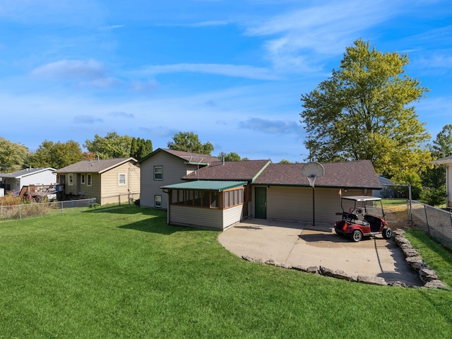 exterior space featuring a carport and a lawn